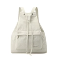 Detail view of the drawstring closure and front zip pocket of the ivory nylon backpack - Bone White