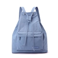 Close-up of light blue drawstring backpack showing nylon texture and logo detail - Iris Blue