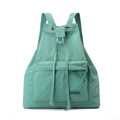 Detail of mint green drawstring backpack showing durable nylon texture and front pocket - Azure Green