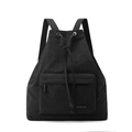 Detail of black nylon drawstring backpack featuring textured fabric and metal eyelets - Ink Black