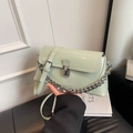 Light green patent leather crossbody bag with silver buckle and chunky chain detail - Green
