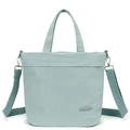 Detail of mint green nylon tote showing the brand logo, texture, and adjustable strap - Soft Mist Green
