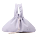 Detail of light purple nylon tote bag with drawstring closure and brand logo plate - Lavender