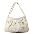 Detail of cream nylon crossbody bag featuring ruched drawstring texture and logo patch - Bone White