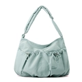 Detail of mint green pleated nylon bag featuring drawstring pockets and wide shoulder strap - Soft Mist Green