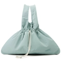 Detailed texture of mint green water-resistant nylon handbag with white drawstrings - Soft Mist Green