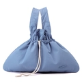 Close-up of light blue nylon handbag showing drawstring closure and brand logo - Iris Blue