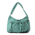 Close-up of mint green pleated nylon bag featuring drawstring details and branded logo - Azure Green