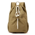 Front detail of khaki nylon drawstring backpack with cotton ropes and large front pocket - Earthy Yellow