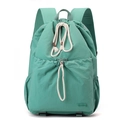 Detail shot of mint green nylon drawstring backpack showing water-resistant texture - Azure Green