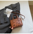 Brown crossbody bucket bag with cartoon prints and adjustable strap on grey blazer - Brown (Without Pendant)