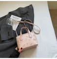 Pink embossed bucket bag with cartoon patterns and shoulder strap on a grey blazer - Pink (No Charm)