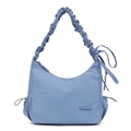 Detail view of fog blue nylon bag featuring soft ruched strap and drawstring bow - Iris Blue