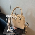 Beige Boston handbag with chain strap and decorative bow in faux leather finish - Khaki With Pendant