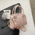 Elegant light pink mini bowling handbag with adjustable strap and silver hardware details - Pink Without Pendant
