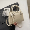 Minimalist creamy white leather bowling bag with dual handles and crossbody strap - Rice White (No Pendant)