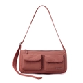 Close-up of pink nylon crossbody bag with dual cargo pockets and adjustable shoulder strap - Berry Red