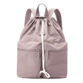 Close-up of light purple drawstring backpack with zip pockets and nylon texture - Peach Pink