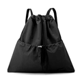 Detail of waterproof black nylon fabric and drawstring closure on a commuter backpack - Ink Black