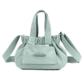Detail of sage green nylon handbag with silicone brand logo and wrinkled texture - Soft Mist Green