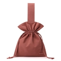 Macro detail of the brick red nylon fabric and the drawstring closure on the handbag - Berry Red