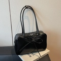 Glossy black hobo bag with large bow detail and long shoulder straps in high shine finish - Black