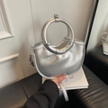 Silver crescent-shaped crossbody bag with metallic finish and oversized circular handle - Silver