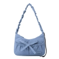 Detail of light blue nylon tote bag showing bow decoration and ruched strap texture - Iris Blue