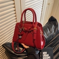 Chic red bridal wedding handbag featuring a heart charm and adjustable crossbody strap - With Charm / Red