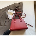 Elegant red bridal handbag with circular handles and a detachable crossbody strap - No Pendant / Red
