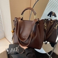 Dark brown textured leather bucket bag with gold metal handle and logo detail - With Charm / Coffee