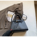 Elegant black leather trapezoid handbag with gold hardware and adjustable strap - No Pendant / Black
