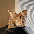 Beige canvas draagtas met kattenprints en een bruine pluche puppy hanger als decoratie - Khaki