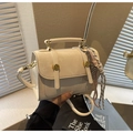 Detail of white leather crossbody bag with gold hardware and woven rope accessory - Beige With Charm