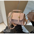 Detailed close-up of pink crossbody bag showing PU leather texture and gold hardware details - Pink with Pendant