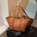 Deep brown leather tote bag featuring a spacious interior and a minimalist FASHION logo - Brown