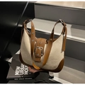 Detail of adjustable leather strap and large metal buckle on beige canvas hobo bag - Off-white