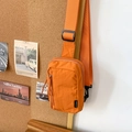 Sporty orange nylon crossbody bag with minimalist lettering and adjustable strap - Orange
