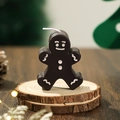 Charming dark brown gingerbread man scented candle with white icing details for Christmas - Black Coffee