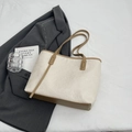 Beige tote bag with brown straps and embossed traditional motifs on a bed background - No Pendant / Khaki