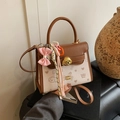 Vintage color-block handbag with puppy prints, gold dog clasp and pink bow accessory - Beige With Charm
