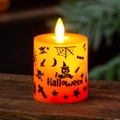 LED Halloween pumpkin candle light with spider web design and flickering flame on wood - Small