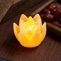 Close-up of a warm yellow LED lotus candle lamp with realistic flickering flame effect - Beige