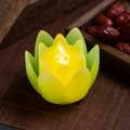 Lotus shaped LED electronic candle with flickering flame on bamboo mat decor - Green