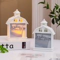 Detail of cottage-style night light showing cozy interior illustration and warm LED glow - Letter E