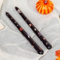Set of two black Halloween taper candles with pumpkin and ghost prints for holiday decor - Skull Bat / Black