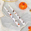 Detail of Halloween paraffin candles with pumpkin and bat prints on white mesh fabric - Skull Bat / White
