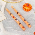 Two orange 25cm Halloween pillar candles with pumpkin and bat prints on white fabric - Skull Bat / Orange