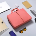 Detailed close-up of pink laptop bag with reinforced handle and side metal buckle - Pink