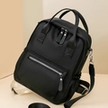 Vista laterale dello zaino nero in nylon con tessuto impermeabile e dettagli in argento - Nero